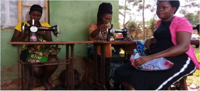 women sewing outside