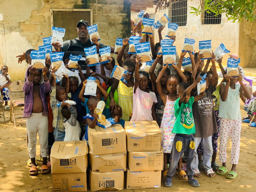 Charity giving out food to children in africa