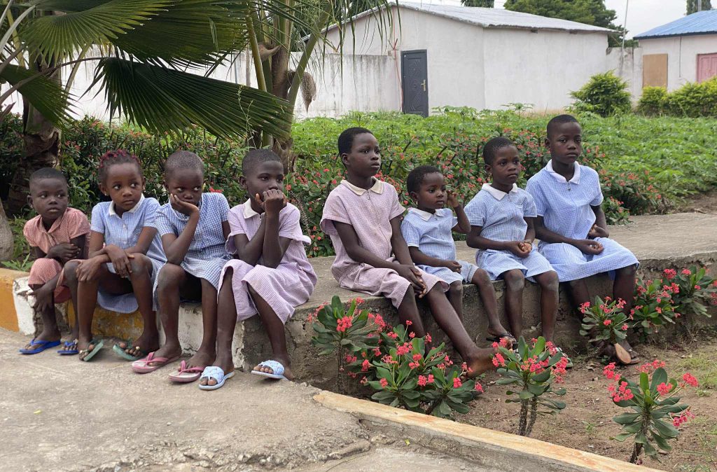 girls sitting outside