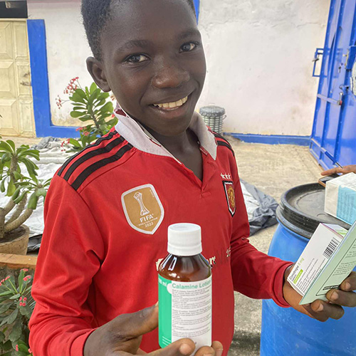 Boy happy to be receiving medicine
