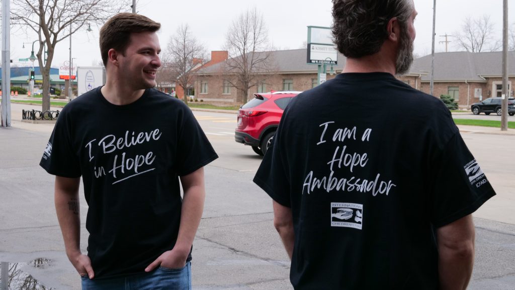 Two men wearing their ICF Hope shirts